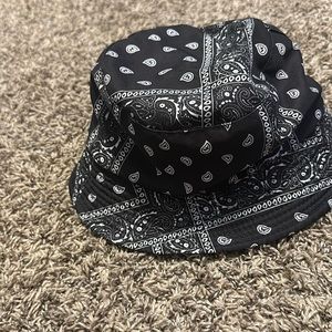 Black bucket hat from Aeropostale with different designs on it in white